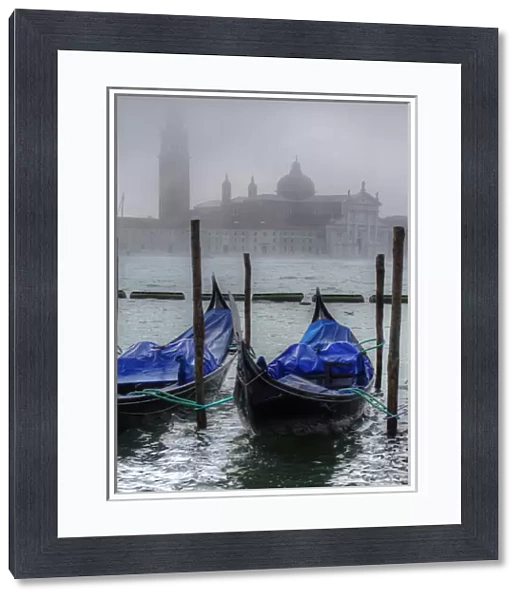 Gondolas along the Grand cana with San Giorgio maggiorel of Venice, Italy