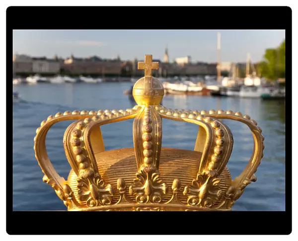 Swedish Royal crown on Skeppsholmen Bridge in central Stockholm, Sweden