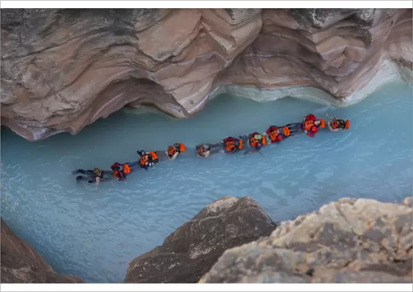 USA, Arizona, Grand Canyon National Park. Students float on blue water of Havasu Creek