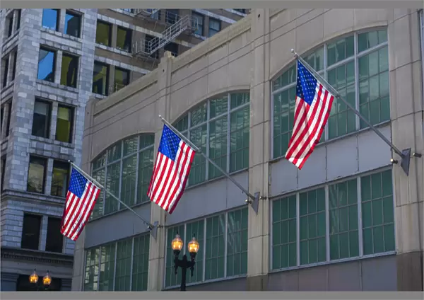 Flags hanging outside an office building in downtown, Chicago, Illinois, USA