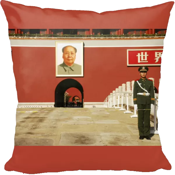 China. Beijing, security guard posted on the Tiananmen Gate of the Forbidden City in the background