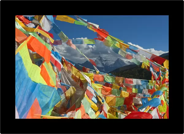One of Three Holy Peaks of Yading Nature Reserve surrounded by Prayer Flags, Sichuan