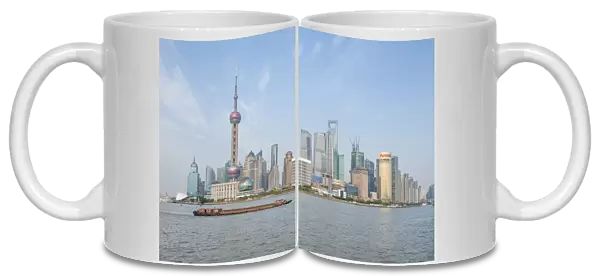 Pudong district skyline with shipping on the Huangpu River Shanghai, China