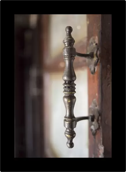 Old fashioned metal doorhandle in Shilpgram artisans village near Udaipur, Rajasthan