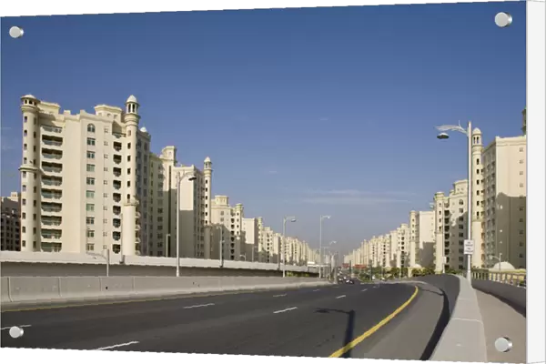 United Arab Emirates, Dubai. Road into the Palm Jumeirah with apartment buildings
