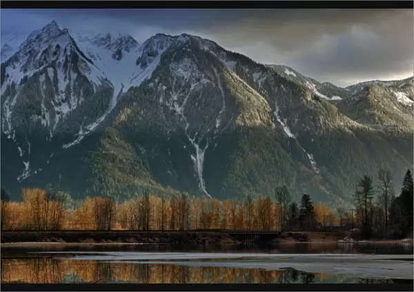 Canada, British Columbia, Agassiz, Seabird Island Road, storm clearing over mountains at sunset