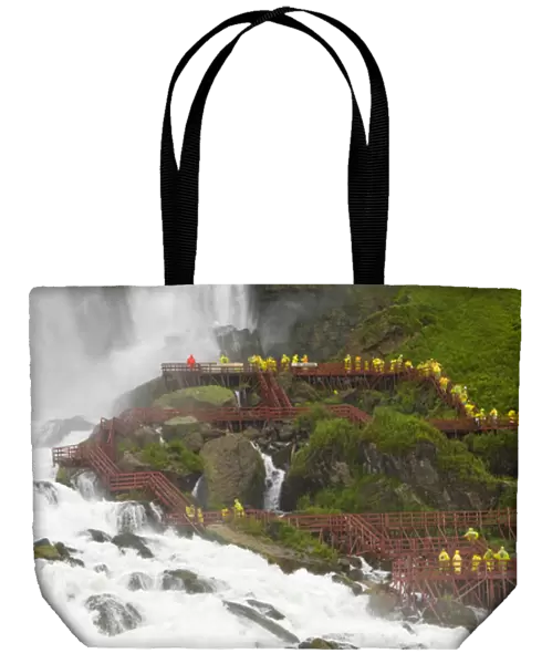 Canada, Ontario, Niagara Falls. Tourists use cliff-side walkways to experience the waterfalls