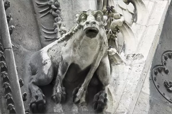 Gargoyle perched on Notre Dame cathedral, Paris, France