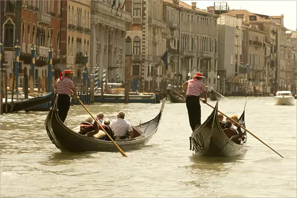 Italy; Venice. Tourist ride in gondolas on the Grand Canal in Venice