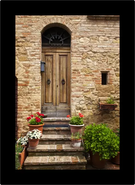 Europe; Italy; Tuscany; Pienza; Doorway withFlowers Around them