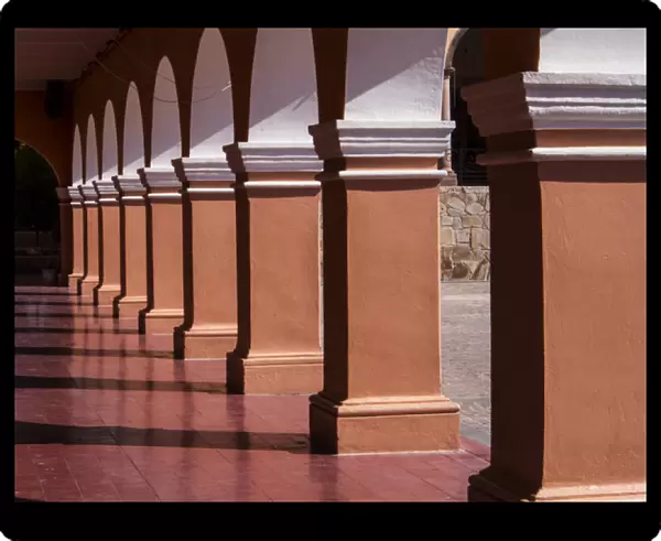 North America; Mexico; Dolores Hidalgo; walk way with Arches of buildings