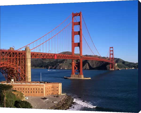 Morning light bathes the Golden Gate Bridge & Fort Point