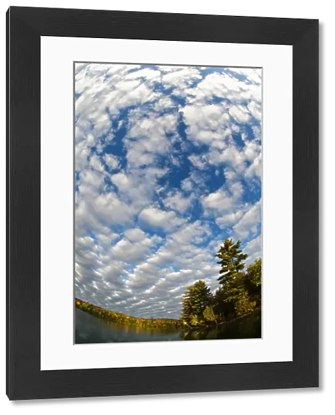 USA, Michigan, Upper Peninsula. Clouds at Petes Lake in autumn