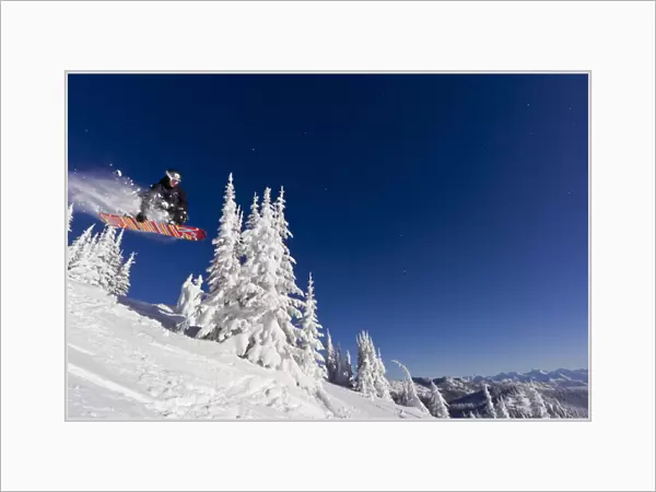 Snowboarding action at Whitefish Mountain Resort in Whitefish, Montana, USA MR