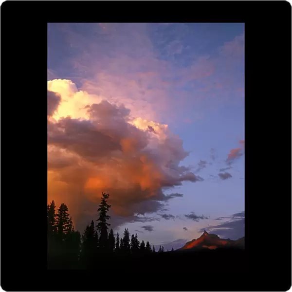 USA, Oregon, Umpqua National Forest. Storm approaching Mt Thielsen at sunset. Credit as