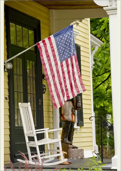 New York, Cooperstown. Typical historic Cooperstown home with flag on veranda