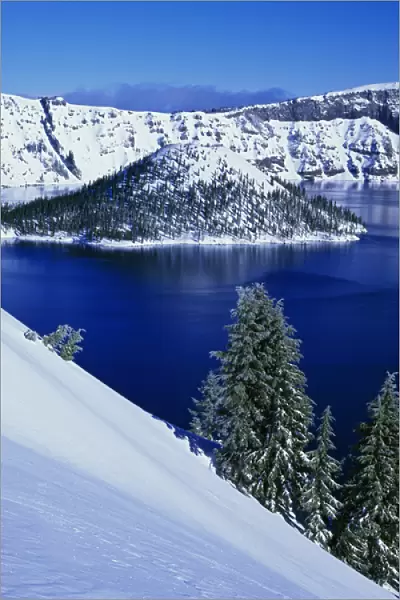 USA, Oregon, Crater Lake National Park. Snow-covered Wizard Island in Crater Lake