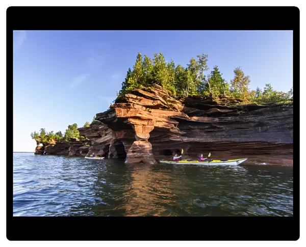 Kayakers exploring the sea caves of Devils Island in the Apostle Islands National Lakeshore
