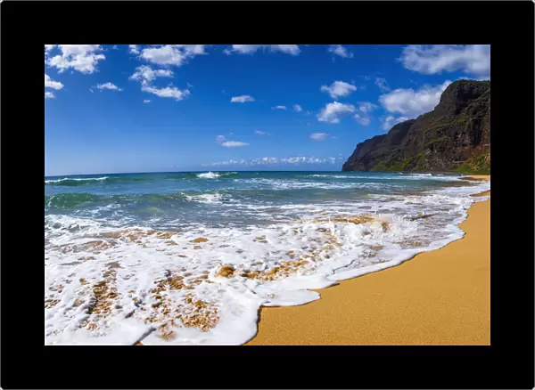 Surf and sand at Polihale Beach, Polihale State Park, Island of Kauai, Hawaii USA