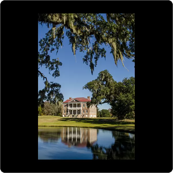 Spanish moss covered tree and the Drayton Hall 18th-century plantation house, Charleston