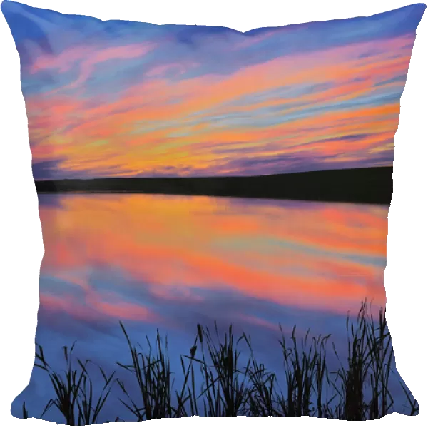 Canada, Saskatchewan, Viscount. Sunset reflected in pond