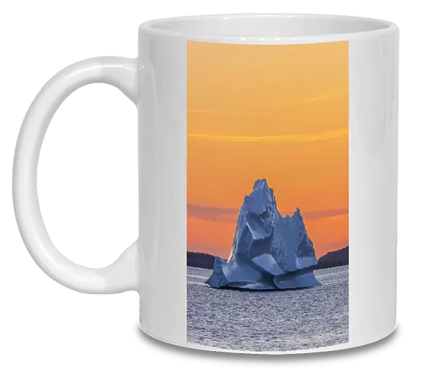 Canada, Newfoundland, Eastport. Iceberg in Bonavista Bay at sunset