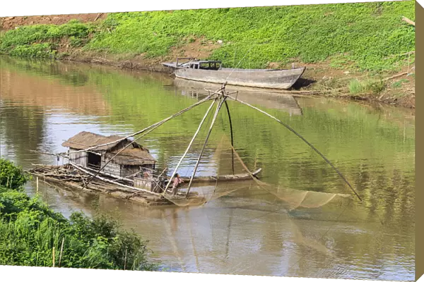 Kratie, Cambodia. Floating Vietnamese houseboat on the Mekong River in Kratie, Cambodia