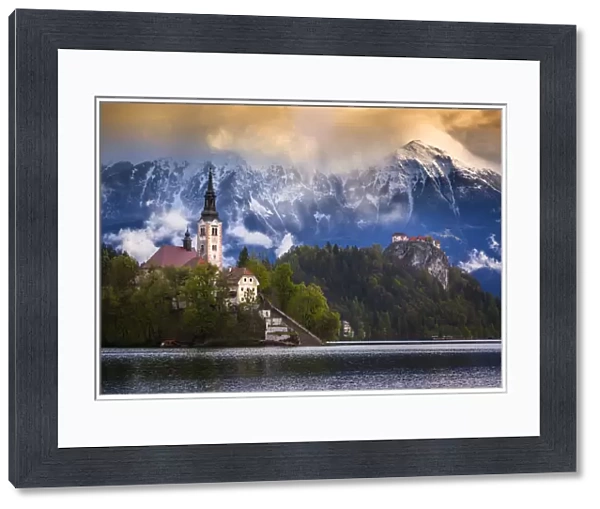 Europe, Slovenia, Lake Bled. Church castle on lake island and mountain landscape. Credit as
