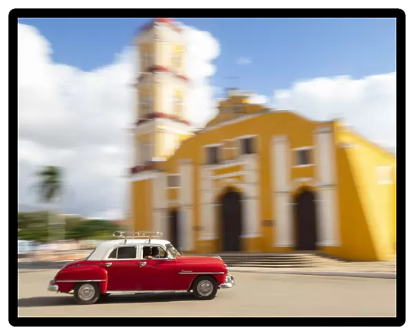 Cuba, Remedios, classic red car in front of Cathedral