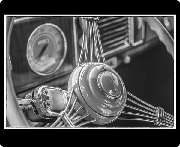 USA, Massachusetts, Essex. Interior detail of antique cars, 1940 s-era steering wheel