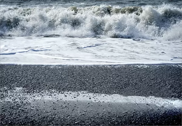 Waves Reynisfjara Black Sand Beach, South Shore, Iceland. Sand is black obsidian