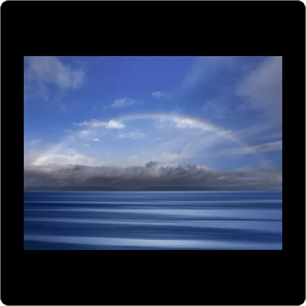 USA, Washington State, Seabeck. Composite of rainbow over Hood Canal