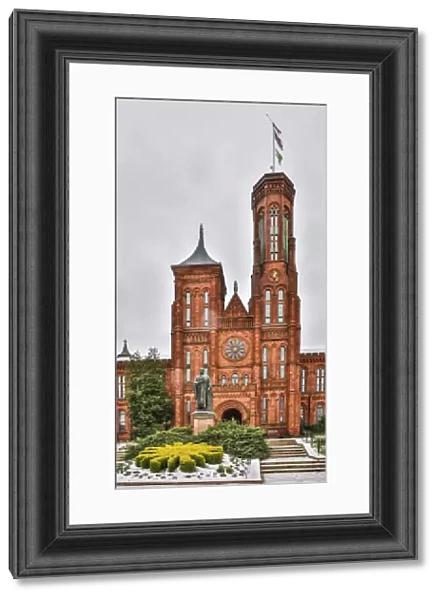 USA, District of Columbia. Smithsonian Castle on a snowy afternoon