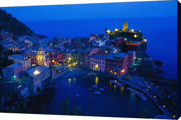 Europe, Italy, Cinque Terre, Vernazza. Hillside town from above in late evening