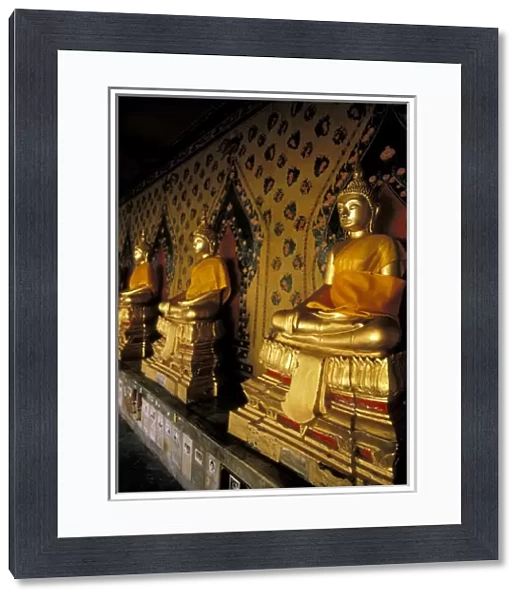 Asia, Thailand, Bangkok. Wat Arun (Temple of Dawn), gallery of golden buddhas