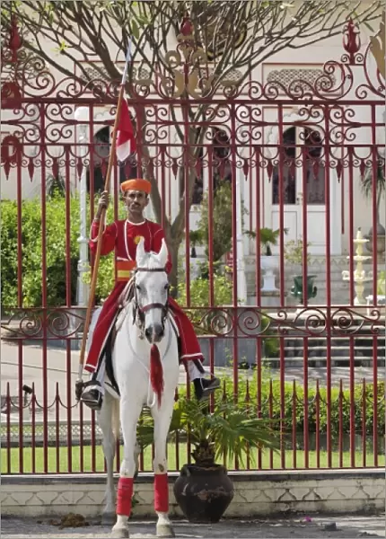 Guard on white horse, City Palace, Udaipur, India
