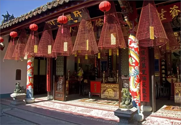 Large incense coils hang from the Phuoc Kien Assembly Hall in Hoi An, Vietnam