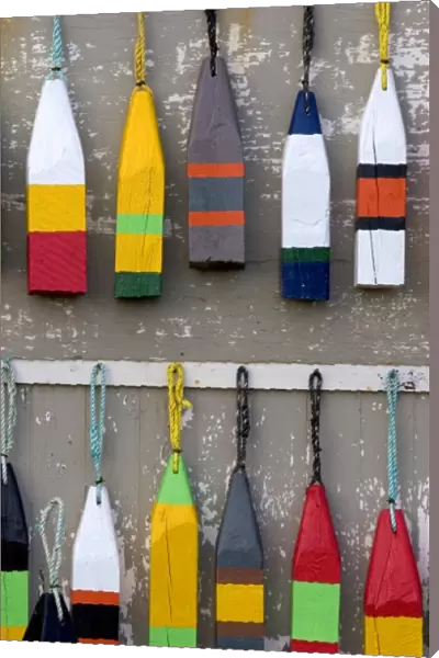 Lobster buoys hang on a wall at a village north of North Rustico on Prince Edward Island, Canada