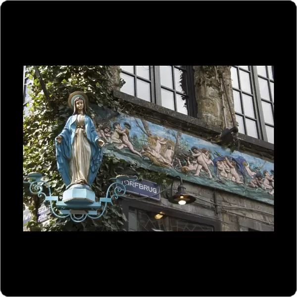 Belgium, Flanders, Antwerp Province, Antwerp, Statue of Madonna on corner of building