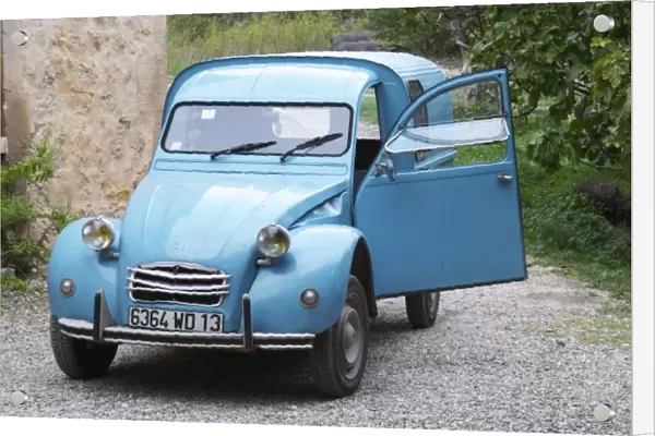 A blue old Citroen 2CV 2 CV converted into a transport van. Moulin Mas des Barres olive mill