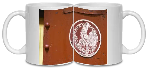 Old red wine press with a sign Materiel Coq with a French cock symbol Domaine la Tourade