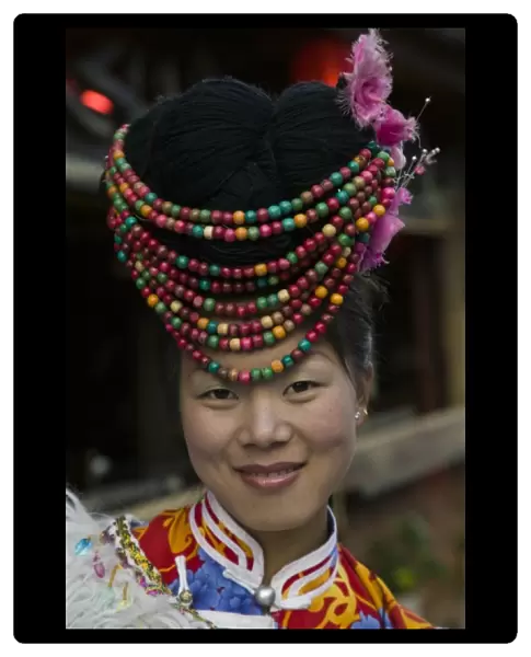 CHINA, Yunnan Province, Lijiang. Old Town, Young Naxi Restaurant Hostess (MR)