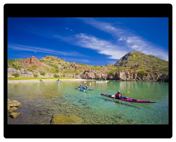 Mexico, Baja, Sea of Cortez. Sea Kayakers in Honeymoon Cove, Danzante Island. (MR)