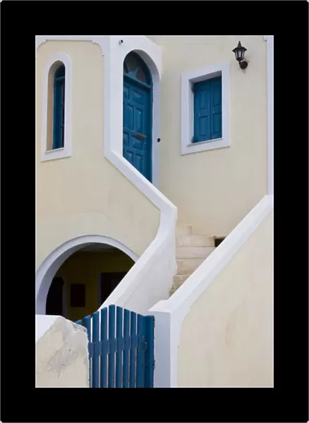 Greece, Santorini, Thira, Oia. Staircase leading from blue gate to blue door and window shutters