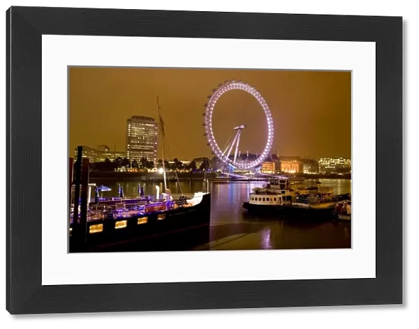 England, London. River Thames and the London Eye at Night