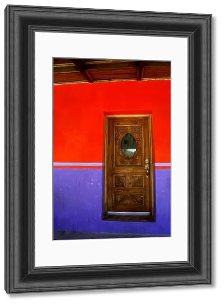 Mexico, State of Chihuahua, Copper Canyon, Creel. Typical street scene, colorful doorway