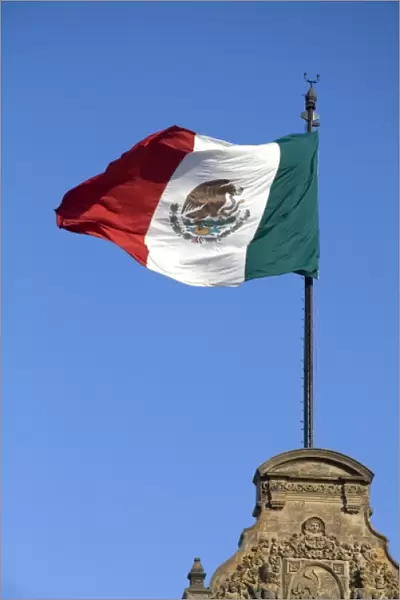 The Flag of Mexico atop the National Palace in Mexico City, Mexico