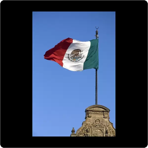 The Flag of Mexico atop the National Palace in Mexico City, Mexico