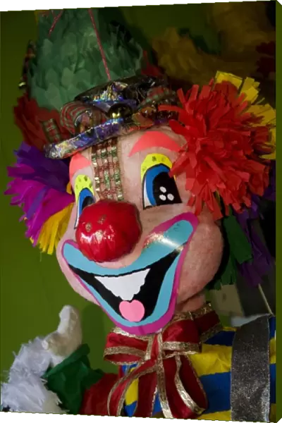 Nicaragua, Granada. Clown pinata on display in shop