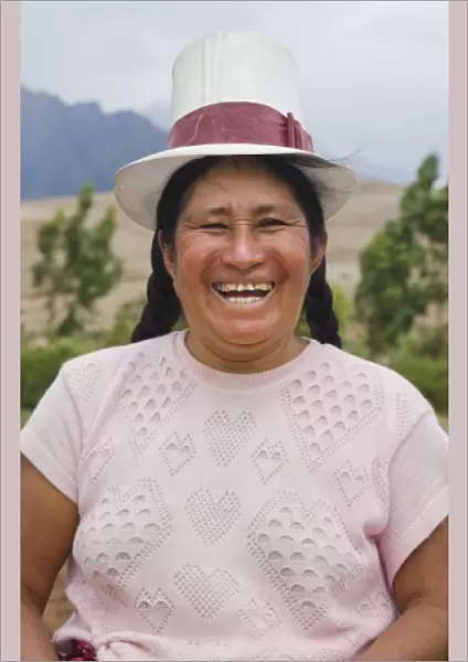 Farming portrait of woman smiling on farm in small town of Chinchero Peru South America